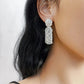 Silver Tag Brushed Metal Drop Earrings